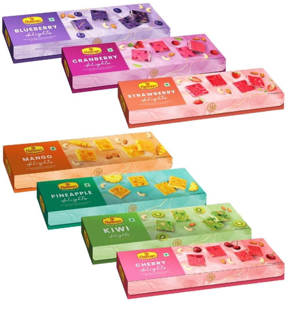 uk61tq6TNCbEL-1.jpg Haldiram's Nagpur Delight Range (Pack Of 7-125 Gm Each) Combo Pack - Fast UK Delivery - Image 1